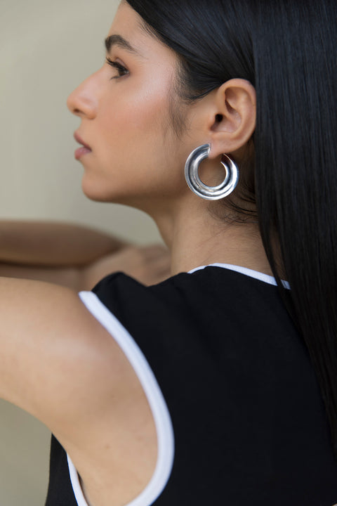 Everyday flat hoops in medium size available in 22k gold and silver finish. Basic jewelry. 